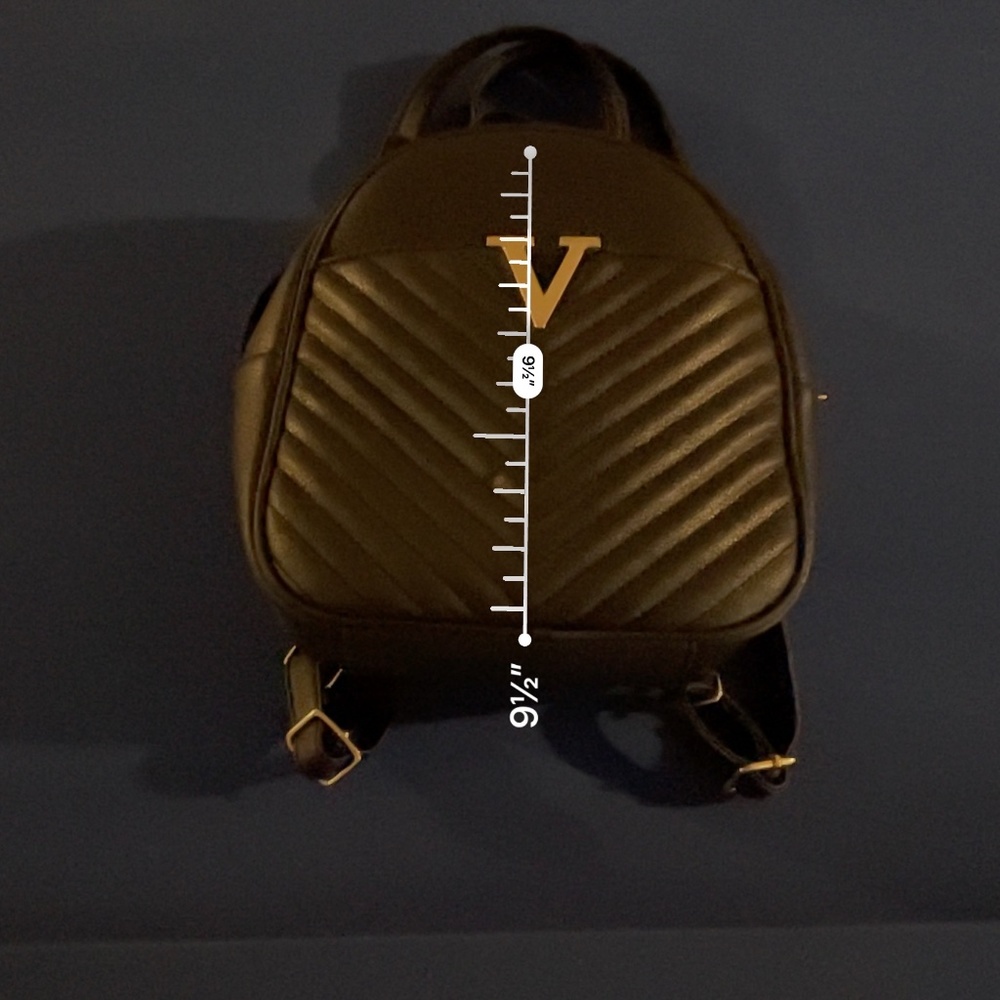 Back pack small black with stitch details on front